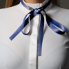 blue self-tie bowtie and white competition shirt