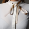 golden self-tie bowtie and white competition shirt