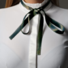 dark green self-tie bowtie and white competition shirt